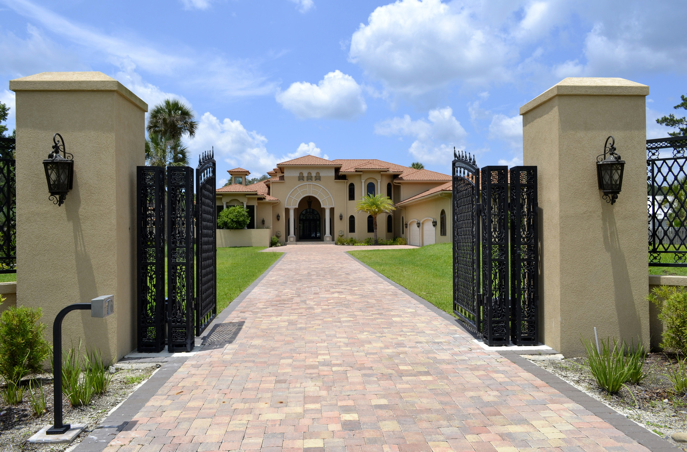 Large driveway and gate to Florida home